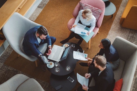 group of diverse business people working in office cafeteria